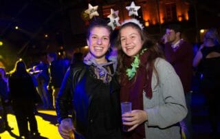 Two girls celebrating the New Year’s Eve party in Barcelona.
