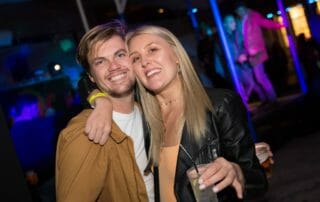 Two friends enjoying the beginning of the year at the New Year’s Eve party in Barcelona.