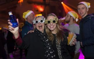 Two friends having a blast at the New Year’s Eve party in Barcelona.