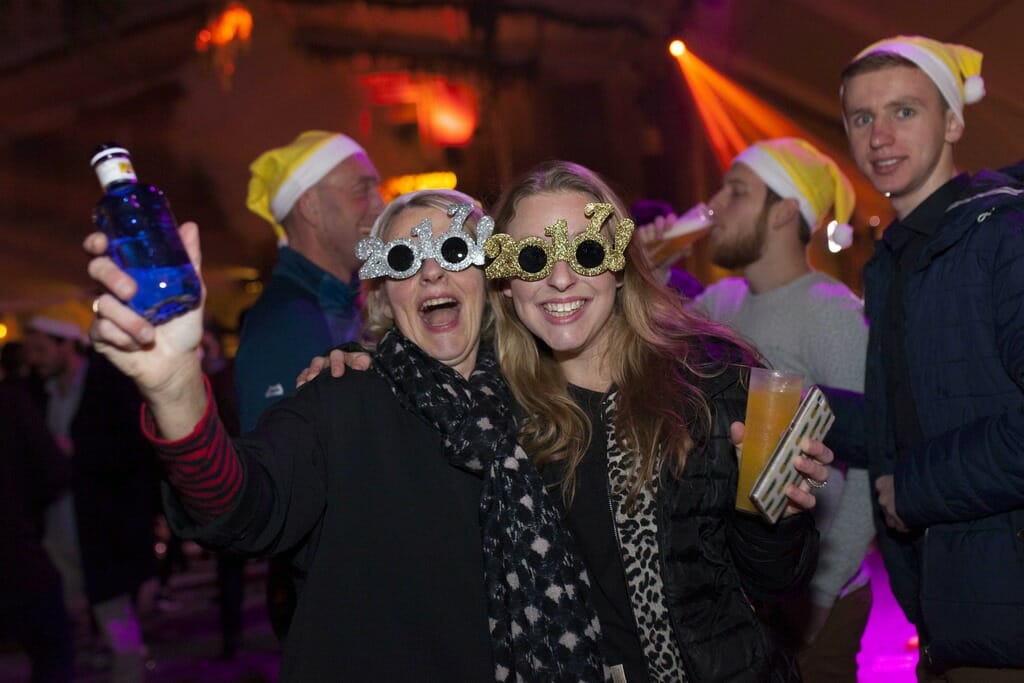 Two friends having a blast at the New Year’s Eve party in Barcelona.